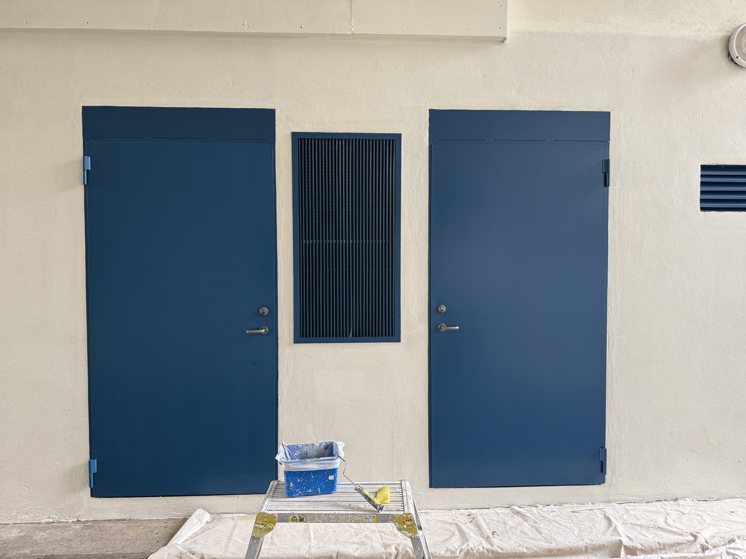 Two exterior doors painted deep blue