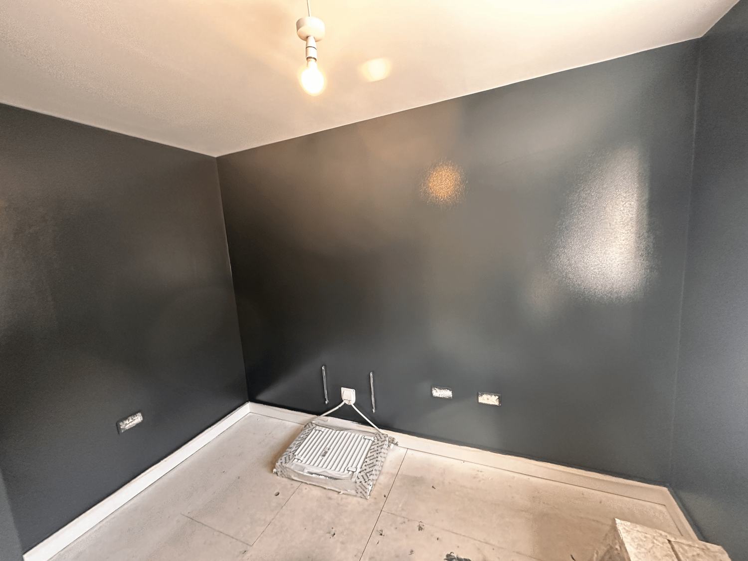 A room with charcoal walls