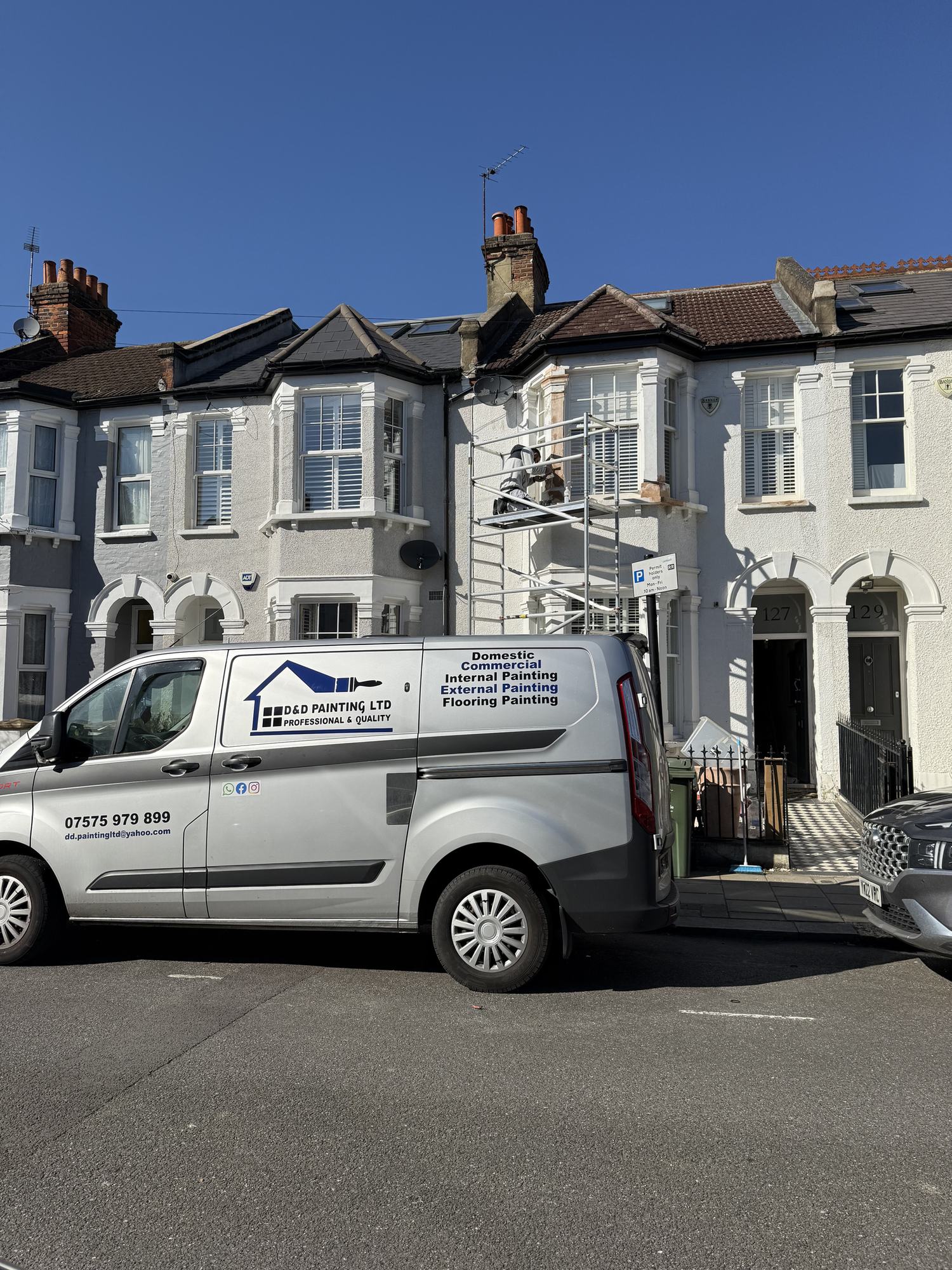 The D&D Painting van parked outside a white Victorian terrace